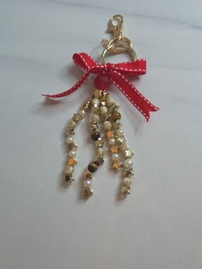 Gold Star Beaded Tassel Bag Charm with Red Ribbon